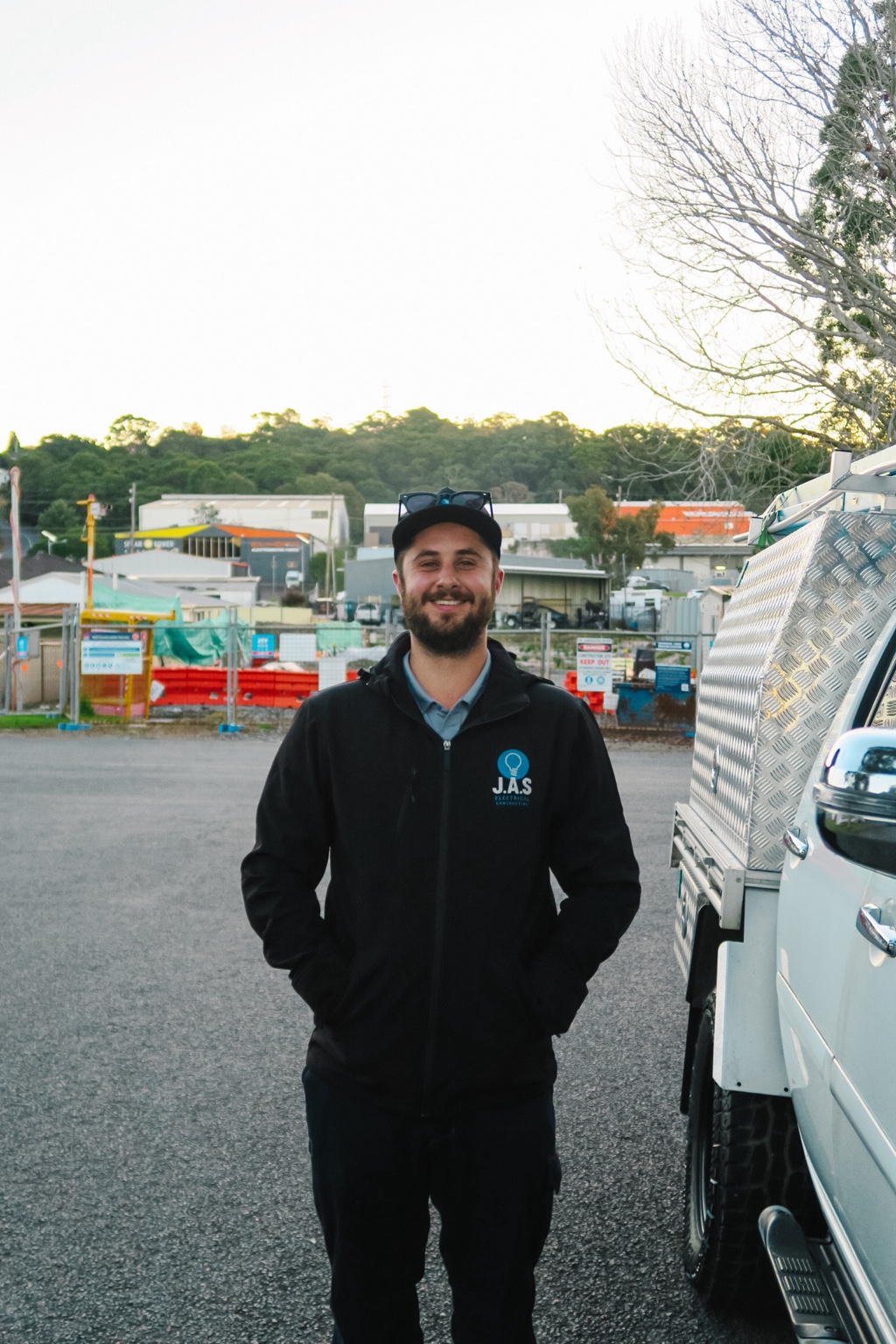 Local J.A.S Electrical contractor beside the work vehicle