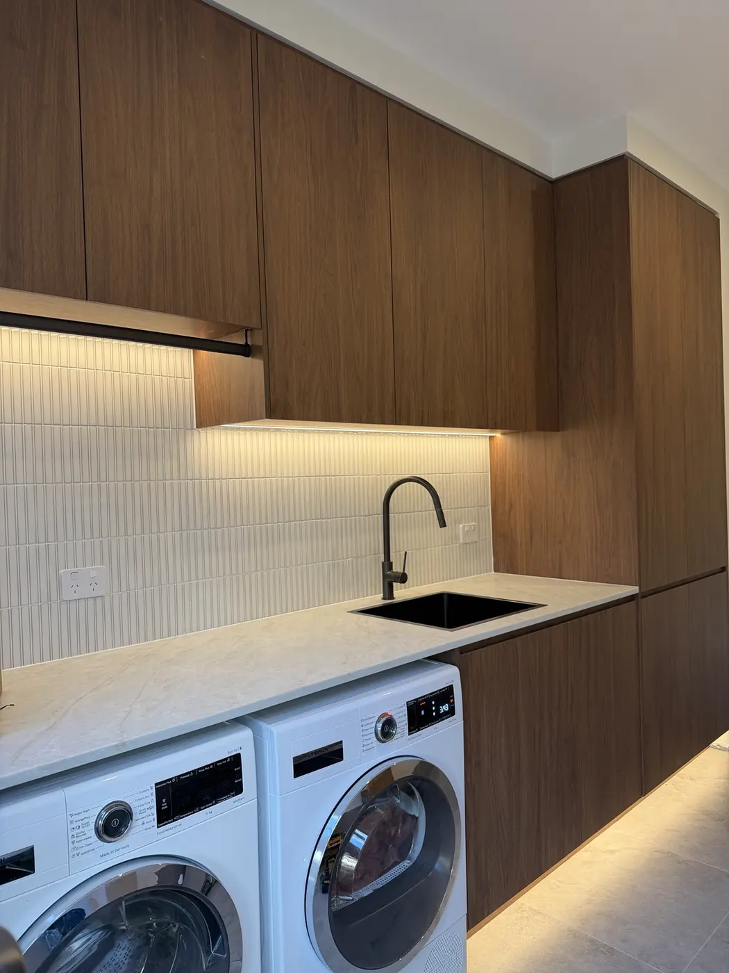 Warm LED strip lighting installed under cabinetry